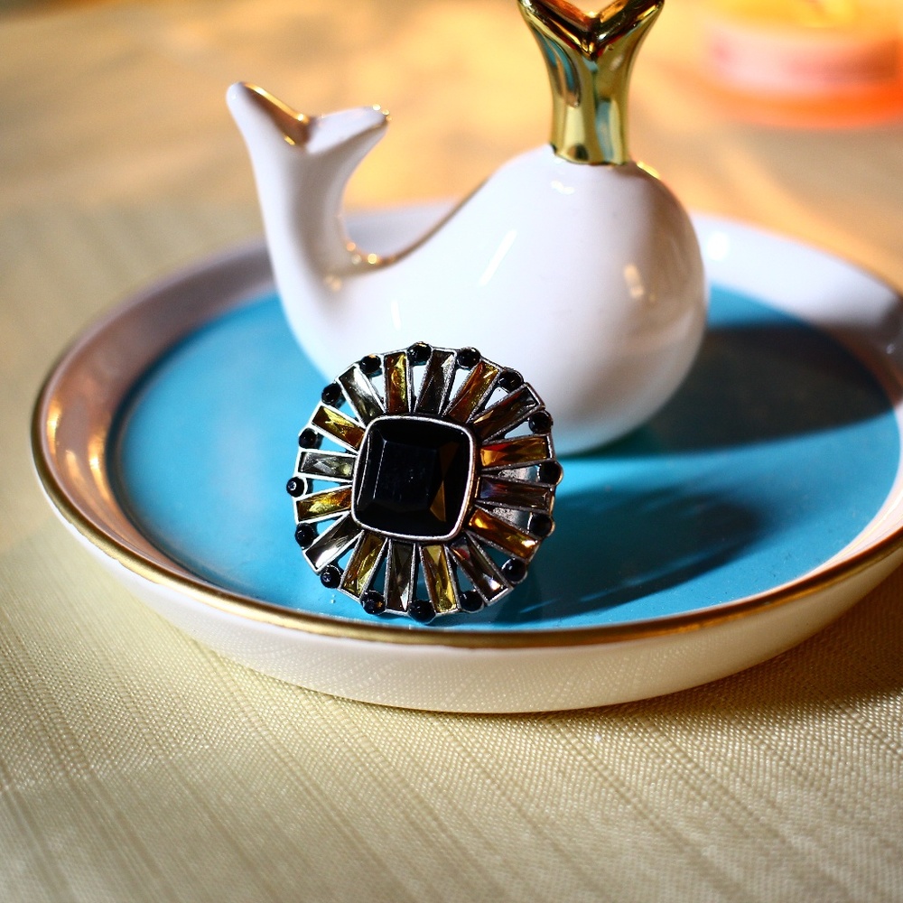 Gold, black, silver ring